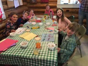 Kids do arts and crafts in a cabin at CM Ranch in Dubois, WY | Dude ranch Wyoming family