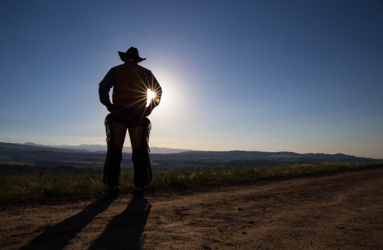 Silhouette of a man in a cowboy hat near CM Ranch in Dubois, WY | Wyoming dude ranch