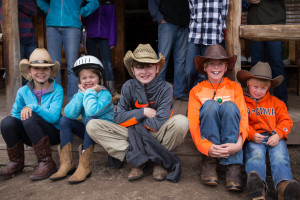 A group of young kids wearing cowboy hats and boots at CM Ranch in Dubois, WY | Wyoming dude ranch