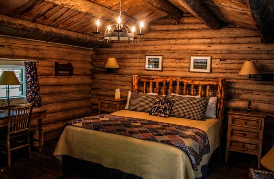 King bed, desk and side table at Dining Cabin 3 | Wyoming Dude Ranch Vacation | CM Ranch