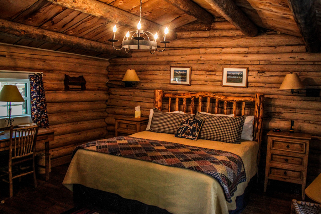 King bed, desk and side table at Dining Cabin 3 | Wyoming Dude Ranch Vacation | CM Ranch