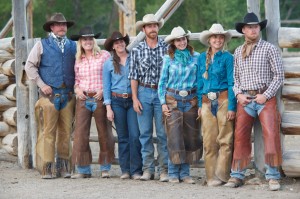 A group of employees in chaps, cowboy boots and hats at CM Ranch in Dubois, WY | Wyoming dude ranch
