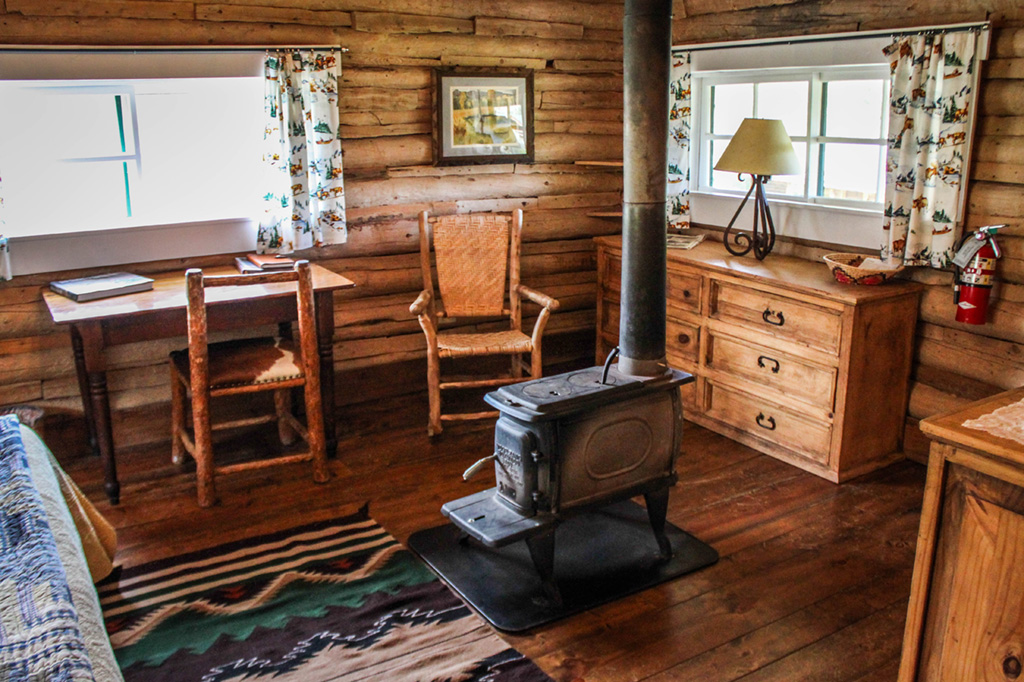 Wood-fired stove in bedroom of Hill Cabin 2 | Affordable dude ranch vacations | CM Ranch