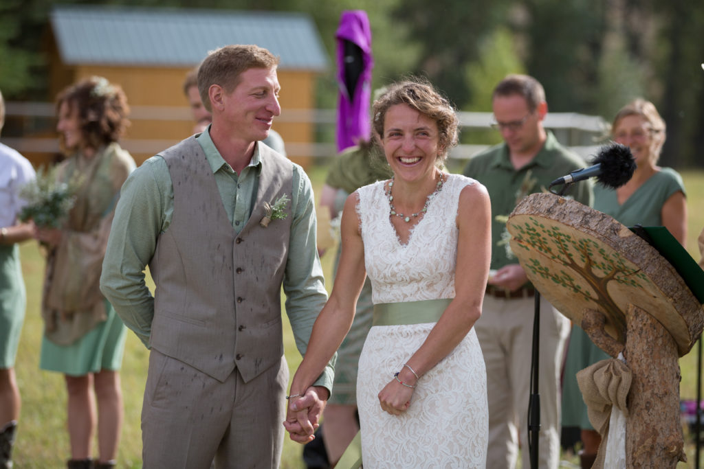 A newlywed couple celebrate their wedding ceremony at CM Ranch in Dubois WY | dude ranch Jackson Hoe